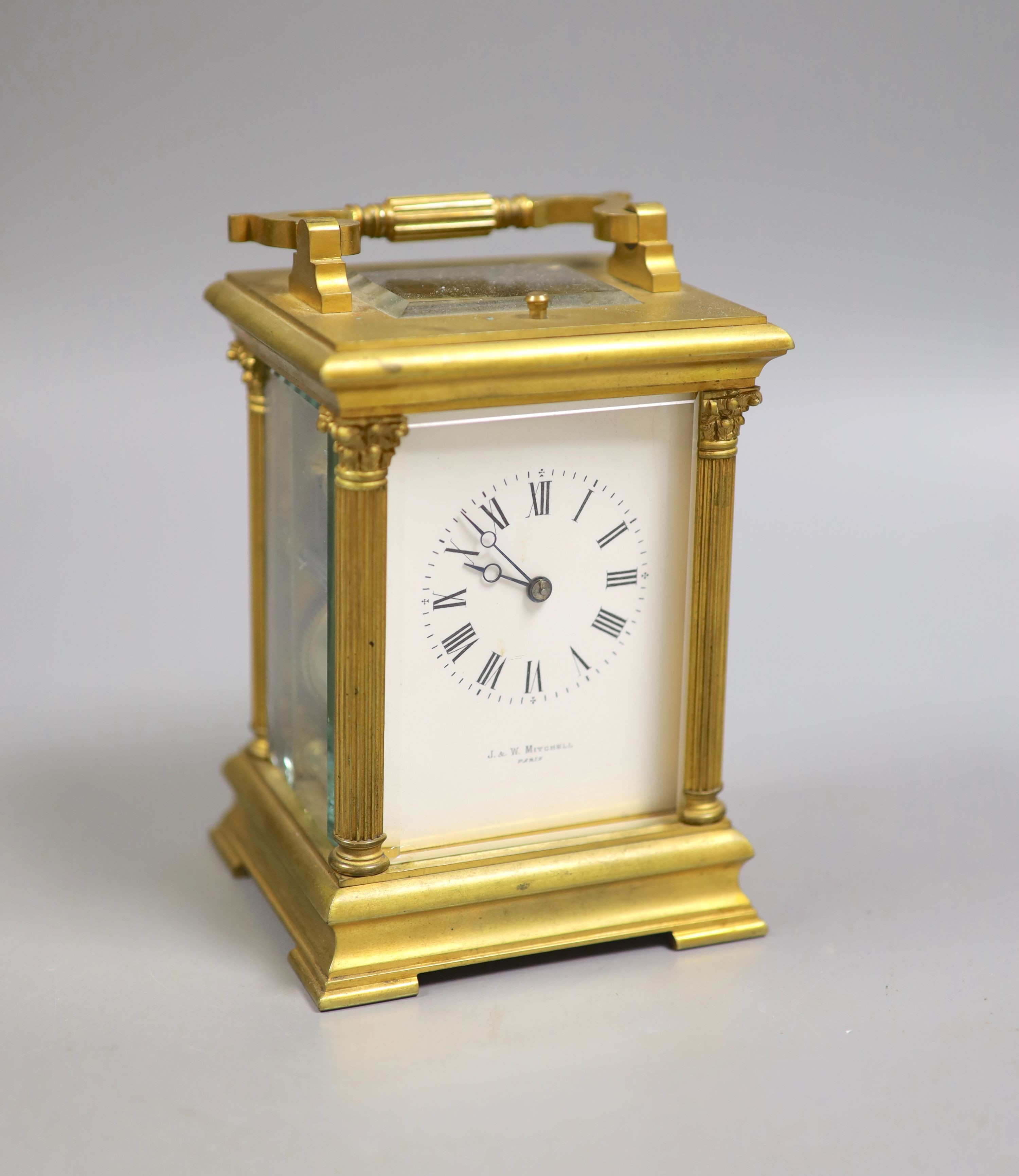 An early 20th century French brass Corinthian pattern repeating carriage clock, 19cm high handle up